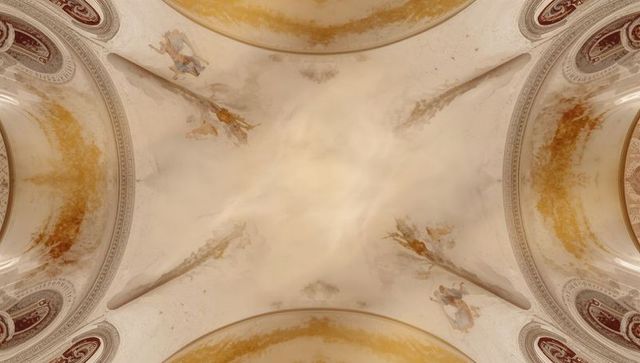 Vaulted church ceiling fresco showing aged patina, painted saints and ornate dome details