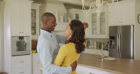 Joyful Couple Dancing Together in Bright Modern Kitchen - Download Free Stock Images Pikwizard.com