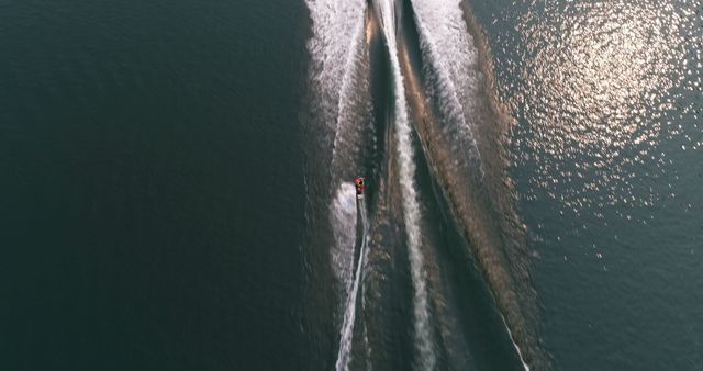 Aerial View of Speedboat Creating Wake Patterns on Water Surface - Download Free Stock Images Pikwizard.com