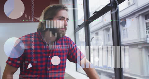 Businessman Analyzing Financial Data Projections Overlaid on Cityscape