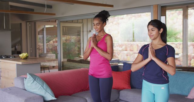 Women Practicing Yoga Together in Modern Living Room - Download Free Stock Images Pikwizard.com