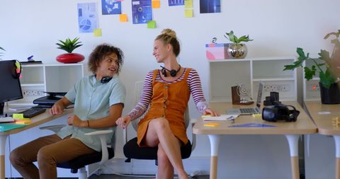 Diverse Colleagues Engaging in Informal Office Interaction