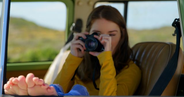 Young Woman Taking Photos from Car Window on Road Trip - Download Free Stock Images Pikwizard.com