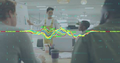 Presenting team brainstorming with colorful data visualization overlay in modern office