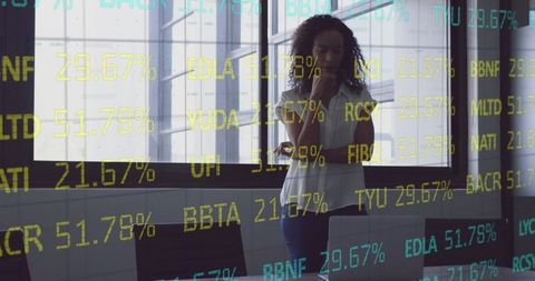 Thoughtful Woman Analyzing Stock Market Data in Office