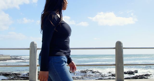 Woman Enjoying Scenic Ocean View Walk Along the Pier - Download Free Stock Images Pikwizard.com