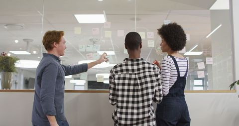 Diverse Team Collaborating with Glass Wall Dedicated to Creative Solutions - Download Free Stock Images Pikwizard.com
