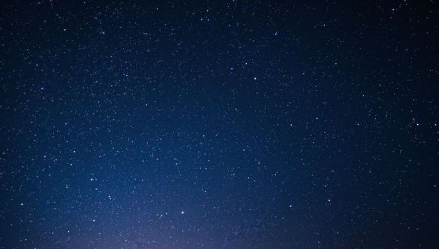 Star-filled Night Sky Revealing Milky Way Band and Bright Star over Remote Horizon