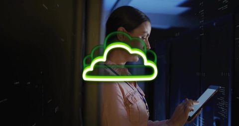 Female it engineer managing cloud ops on tablet in dim server room with neon cloud overlay