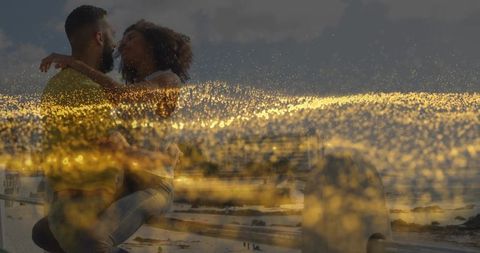 Romantic Couple Embracing with Golden Sunset Sparkles