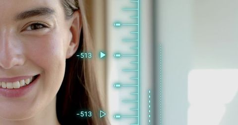 Smiling woman with turquoise biometric hud measuring facial features for identity tech