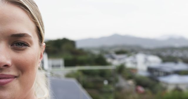 Close-Up Portrait of Smiling Woman Outdoors with Mountains in Background - Download Free Stock Images Pikwizard.com