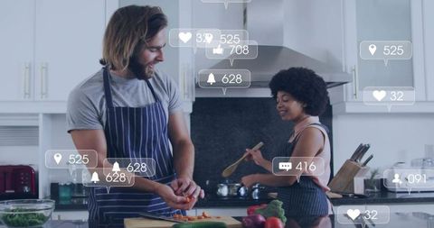 Couple cooking together in modern kitchen with social media engagement overlays