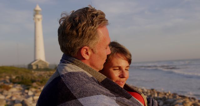 Romantic Couple Embracing Near Lighthouse During Sunset - Download Free Stock Images Pikwizard.com