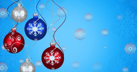 Festive Christmas Ornaments with Snowflake Motif on Blue Background