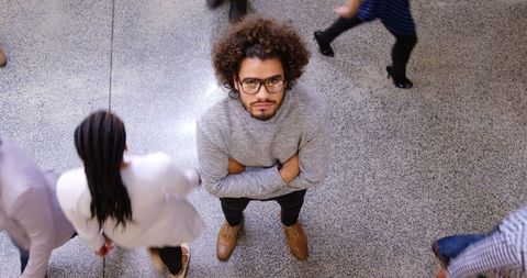 Confident Young Professional in Busy Office Environment