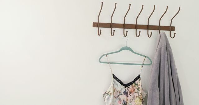 Empty Coat Rack with Hanging Clothes Against White Wall - Download Free Stock Images Pikwizard.com