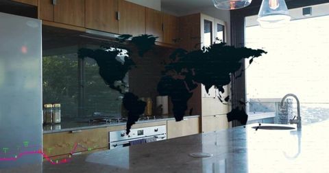 Dark world map graphic projecting across marble kitchen island with minimalist wood cabinets