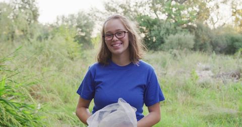 Happy Volunteer Engaging in Eco-Friendly Clean-Up Effort