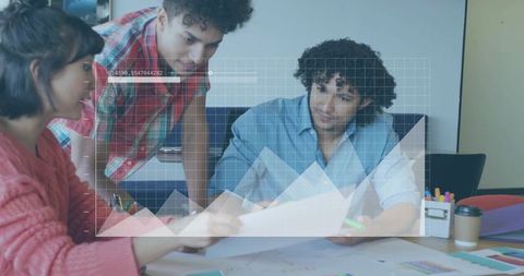 Young Team Collaborating Over Documents and Charts with Transparent Grid Data Overlay