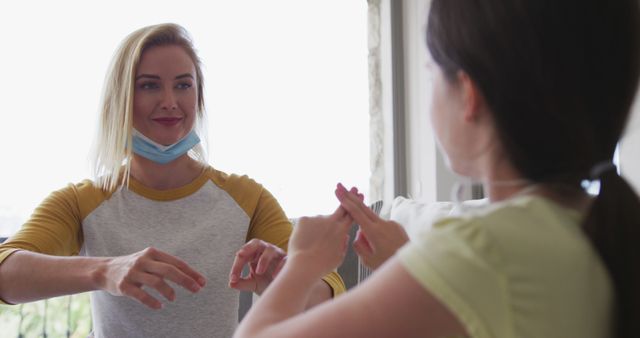 Woman Teaching Sign Language to Child at Home - Download Free Stock Images Pikwizard.com