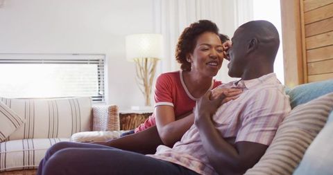 Loving Couple Sharing Private Moments in Modern Living Room