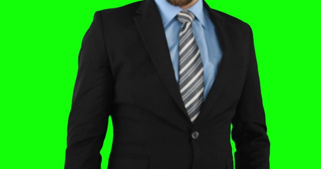 Man in formal business attire with green screen background. Useful for corporate presentations, business advertisements, and professional branding. Ideal for digital content creators needing a customizable background to overlay different scenes.
