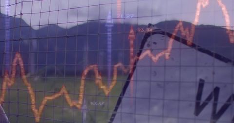 Wire-mesh fence with overlayed financial chart in landscape