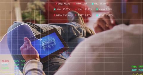 Man analyzing financial data on tablet with overlay graphics
