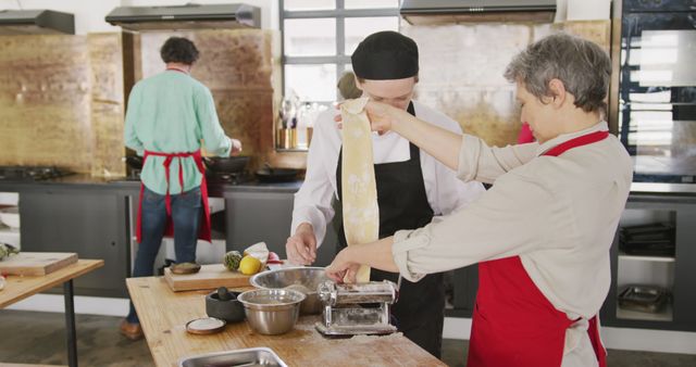 Senior Woman Teaching Young Chef to Make Fresh Pasta in Kitchen - Download Free Stock Images Pikwizard.com