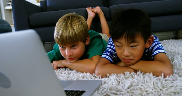 Kids Lying on Carpet Watching Laptop Screen Together - Download Free Stock Images Pikwizard.com