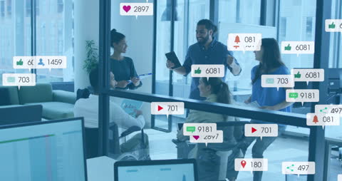 Diverse Team Collaborating in Modern Office with Social Media Notifications