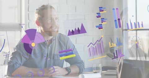 Bearded man presenting digital charts during collaborative data analytics meeting