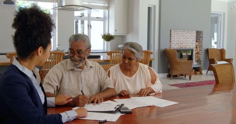 Senior Couple Signing Property Documents with Real Estate Agent - Download Free Stock Images Pikwizard.com