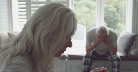 Senior Couple Engaged in Emotional Conversation at Home