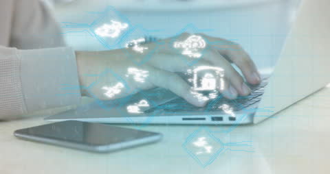 Technology Icons Overlay Hands Typing on Laptop