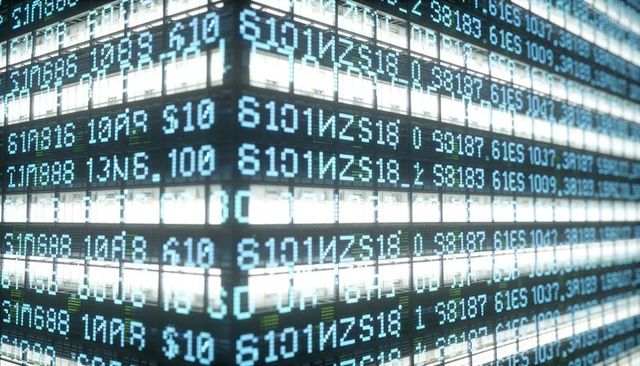 Glowing office tower corner at night with blue alphanumeric data ticker overlay