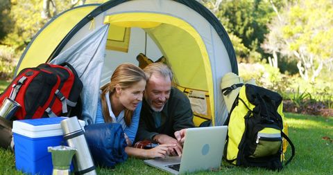 Happy Couple Using Laptop in Tent on Camping Trip - Download Free Stock Images Pikwizard.com