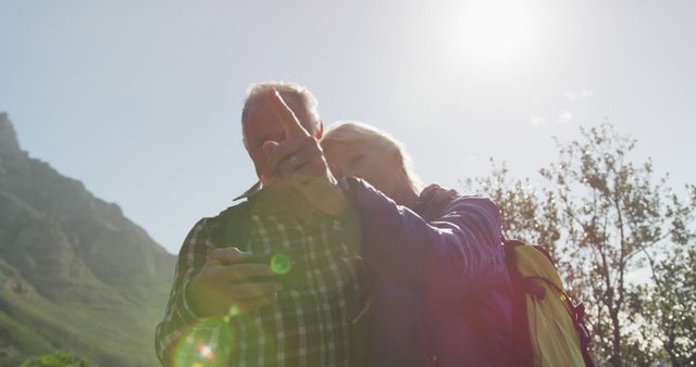 Senior Couple Hiking in Nature Using Map and GPS - Download Free Stock Images Pikwizard.com