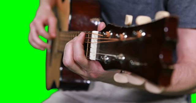 Man playing acoustic guitar close-up on green screen background - Download Free Stock Images Pikwizard.com