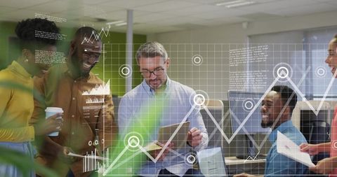 Team leader presenting analytics on tablet with engaged coworkers reviewing growth graphs