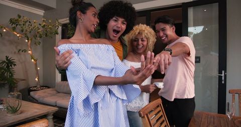 Group Celebrating Engagement with Enthusiasm