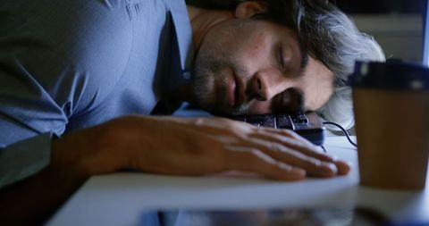 Tired Young Male Executive Sleeping at Desk in Modern Office - Download Free Stock Images Pikwizard.com