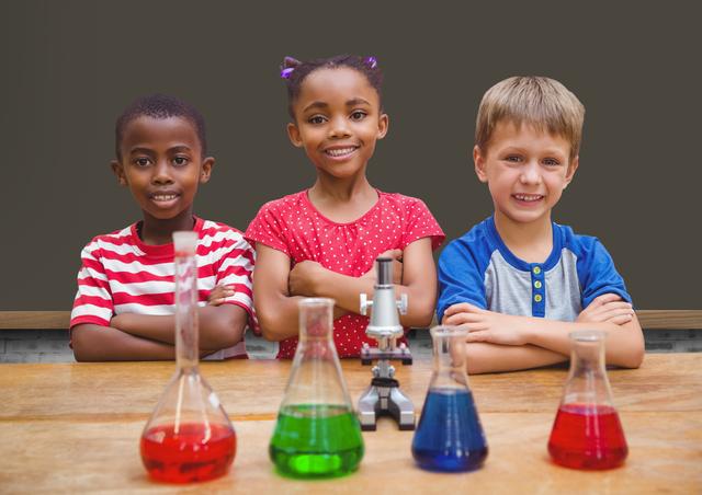 Group of diverse children in a chemistry lab smiling confidently with beakers holding colorful solutions and a microscope on the table. Ideal for educational materials, science promotion, classroom decor, or content about diversity and STEM.