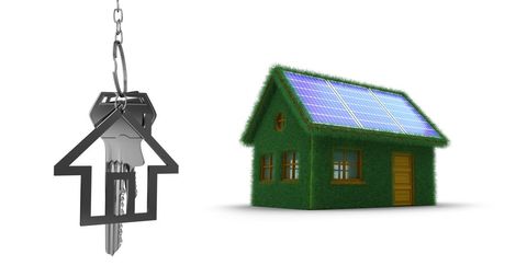 Eco-friendly house concept with solar panels and keys