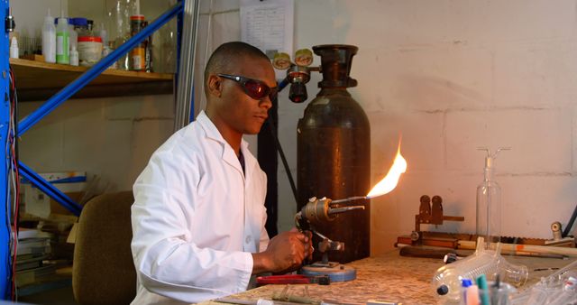 Experienced Chemist Conducting Laboratory Experiment with Bunsen Burner - Download Free Stock Images Pikwizard.com