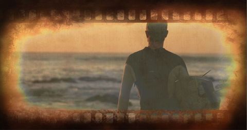 Surfer alone on dusk beach with vintage filmstrip effect