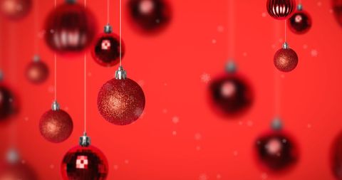 Glittering Christmas Baubles on Red Holiday Background