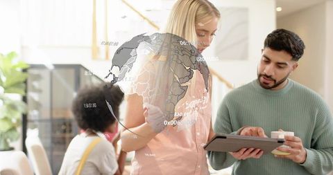 Colleagues collaborating over tablet with ar globe and interactive data visualization