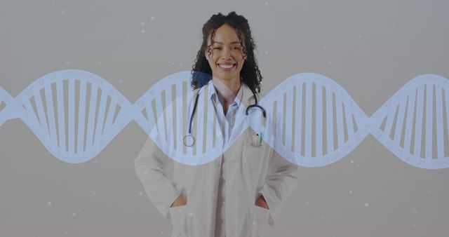 Image of dna strand moving over smiling biracial female doctor on grey background. Medical services, medicine and healthcare concept digitally generated image.